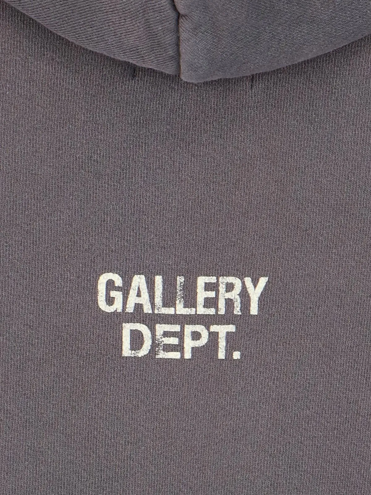 GALLERY DEPT. 90'S RECYCLE HOODIE WASHED BLACK 90'S washed hoodie with distressed eco-friendly slogans. Washed black S-XL. Ready-made garments are washed and dyed again. Multiple spots throughout the body are spray-faded. The ribs are cut and worn.